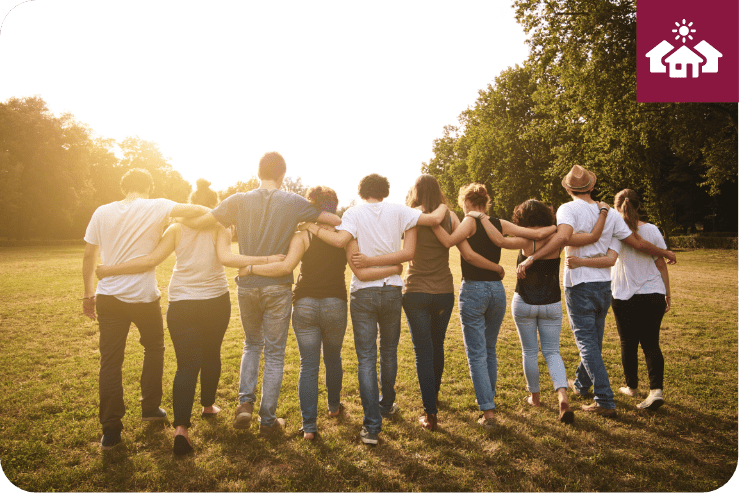 Group of people with arms around each other